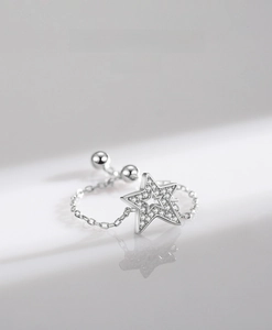 Macro detail of adjustable S925 silver star ring with micro-pave cubic zirconia stones