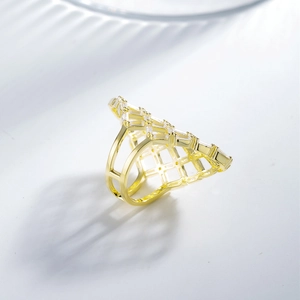 Exquisite hollow mesh gold ring with baguette zircon stones in a modern geometric style
