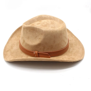 Detail of camel suede cowboy hat featuring brown leather band and metallic buckle