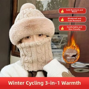 Close-up of winter knit beanie and neck warmer set with faux fur lining and pompom details