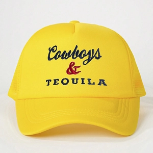 Close-up of Cowboys & TEQUILA embroidery on a yellow breathable mesh trucker hat