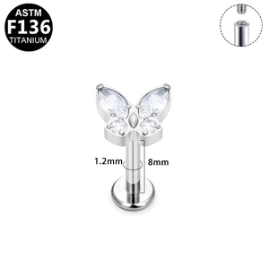 Macro detail of silver titanium butterfly labret with zircon and 1.2x8mm internal thread