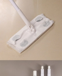 Detail view of Japanese dusting mop head with snap-on slots and threaded metal handle