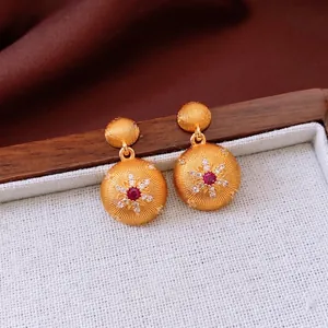 Vintage 24k gold plated round drop earrings with red gemstone and sunburst design