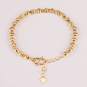 Gold plated stainless steel beaded bracelet featuring a heart pendant and etched beads