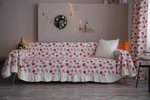 Detailed Christmas candy print sofa cover featuring festive ruffled edges and holiday decor