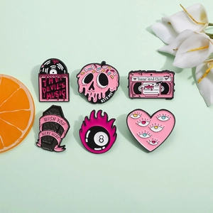 Set of 6 creative pink enamel pins featuring record and coffin designs on green background