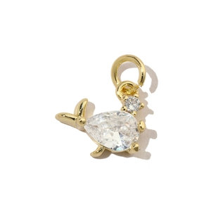 Macro shot of gold-plated fish pendant with large teardrop cubic zirconia inlay