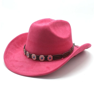 Detail of pink faux suede cowboy hat with brown leather band and blue stone studs