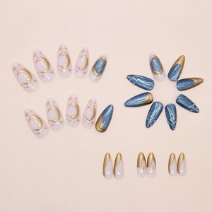 Close-up of 24pcs press on nails featuring golden stars, moon patterns and blue cat eye effects