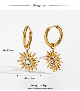 Detail of gold sunburst drop earrings with zircon inlay showing dimensions 30mm x 15mm