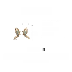 Detail view of gold koi fish earrings with turquoise and pink rhinestones 2x4cm size