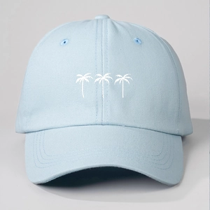 Detailed embroidery of three white coconut trees on a light blue cotton baseball cap