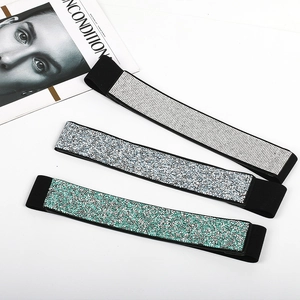 Three rows of elastic waistbands with shimmering rhinestones in white, multicolor, and green