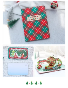 Detail of 3D pop-up Christmas wreath greeting card with red and green plaid cover