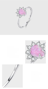 Macro shot of S925 sterling silver stamp and pink teardrop opal prong setting on ring