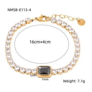 Detail of gold titanium steel bracelet with black rectangular gem and sizing tag