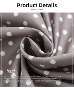 Close-up of beige polka dot silk scarf showing delicate twill weave texture and drape