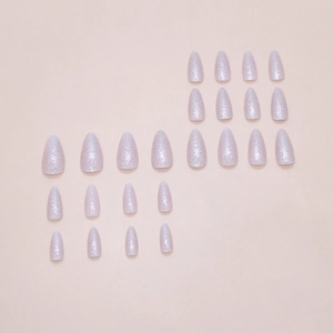 Set of 24 sparkling silver and light purple almond press on nails on pink background