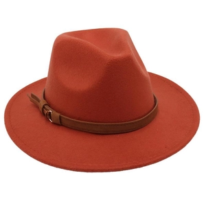 Detailed texture of caramel wool fedora hat featuring dark brown leather belt buckle