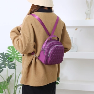 Purple diamond-quilted waterproof nylon mini backpack for women with adjustable straps