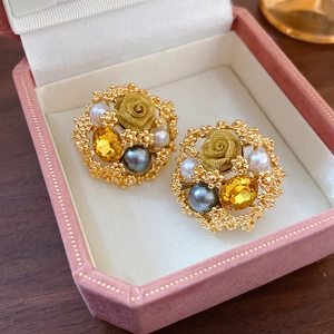 Luxury floral pearl earrings with yellow crystals in a velvet jewelry gift box