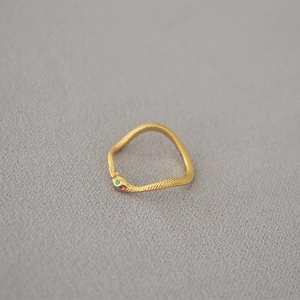 Minimalist gold snake ring with textured scales and colorful gemstone eyes for women