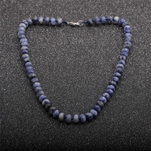 Close-up of blue-grey natural stone beaded necklace with a secure silver metal clasp