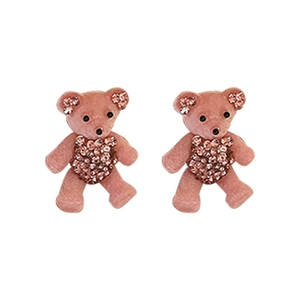 Cute pink flocked bear earrings with sparkling rhinestone bellies on white background