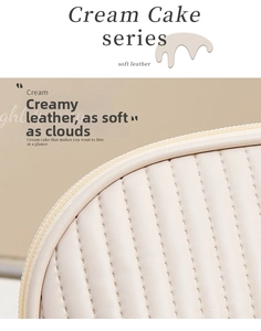 Detailed close-up of cream quilted leather texture and vertical stitching on makeup bag