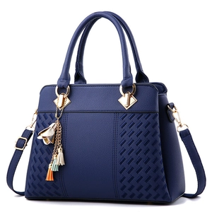 Deep blue lychee texture PU leather handbag with gold hardware and floral tassel charm