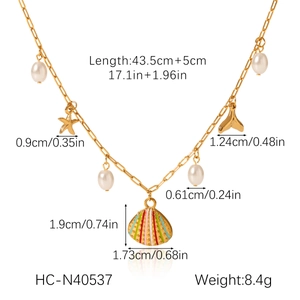 Detailed view of ocean style gold necklace with shell and starfish charms and measurements
