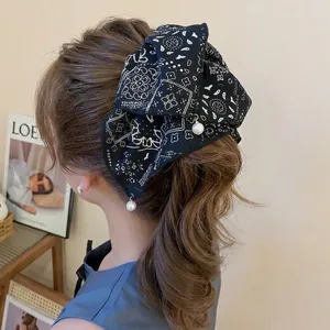 Elegant black paisley bow hair claw clip with pearl drops for women hair styling