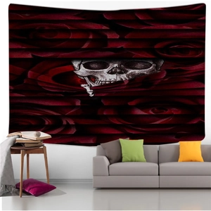 Detail of gothic tapestry featuring a realistic skull and dark red roses on a black wall hanging