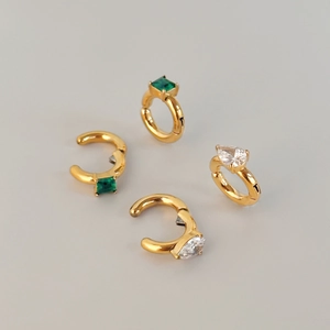 Set of four gold stainless steel ear cuffs with square green and drop white zircons