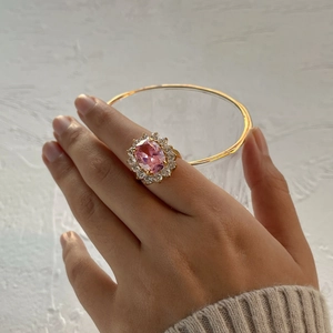 Elegant 18K gold stainless steel ring with pink oval zircon and side diamond accents