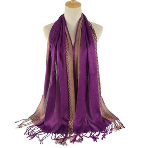 Deep purple scarf with golden geometric jacquard pattern and fringes on white background