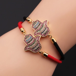 Hamsa Hand evil eye bracelets in red and black woven rope with colorful zircon accents