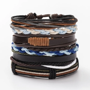 Detailed close-up of multi-layer leather bracelets with woven cords and mixed textures