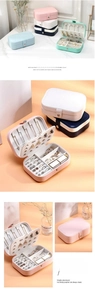 Multi-compartment travel jewelry box in five colors with hooks and ring slots