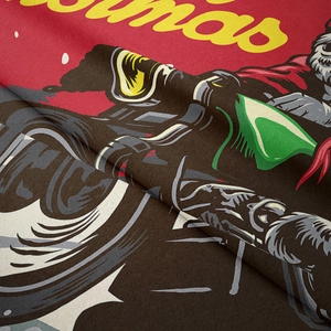 Close-up of flannel Christmas tapestry showing soft fiber texture and vivid motor rider print