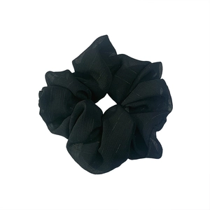 Minimalist black oversized gauze scrunchie with pleated silk texture on a white background