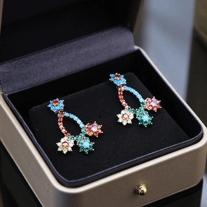 Elegant multicolored zircon flower earrings presented in a luxury light gold jewelry box