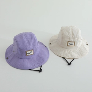 Detail of quick-dry sun hats for kids showing adjustable wind ropes and metal side snaps