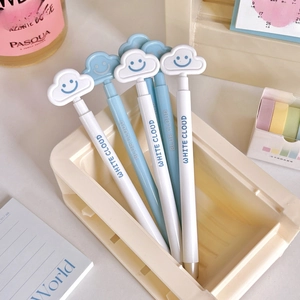 Close-up of minimalist retractable gel pens with cute cloud shaped smile toppers