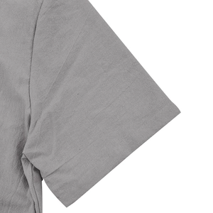 Detailed close-up of gray cotton linen short sleeve shirt shoulder and fabric texture