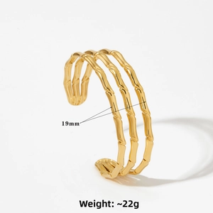 Detailed view of 19mm wide triple-layer bamboo joint gold cuff bangle weighing 22g