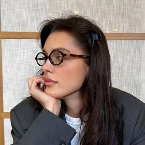 Vintage tortoiseshell oval glasses frame with blue light blocking lenses on a female model