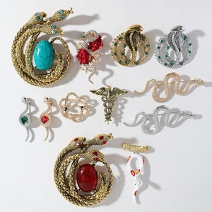 Vintage enamel snake brooches in gold and silver finish with rhinestones for suits