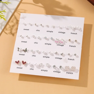 20-piece set of silver-tone stud earrings with white pearls and butterfly heart designs